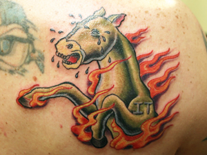 bad tattoos horse fire mascot