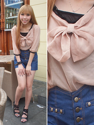 light pink silk blouse with bow and high waisted denim shorts valentine's day outfit